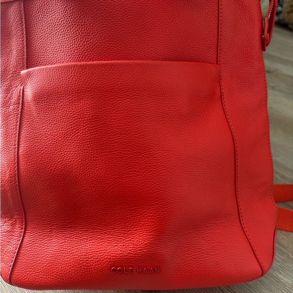 New condition Cole Haan leather poppy orange red mini backpack bag